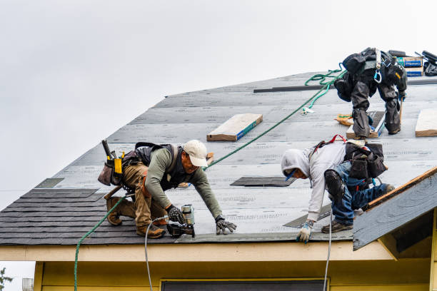 Professional Roof Replacement technician working in Mooreland, OK